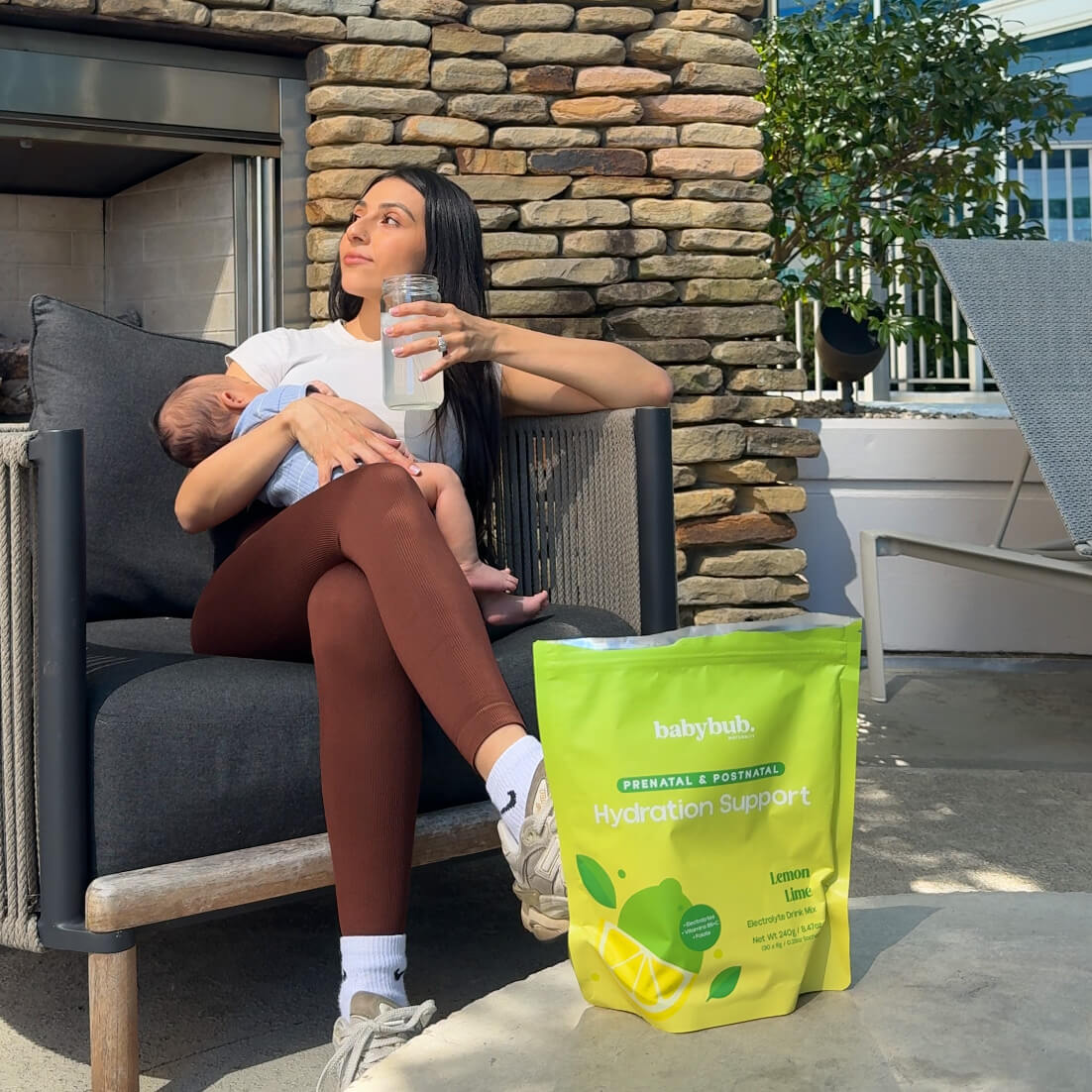 Pregnant mom sipping babybub through a straw